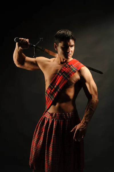 The hot soldier wears a highlander outfit — Stock Photo, Image