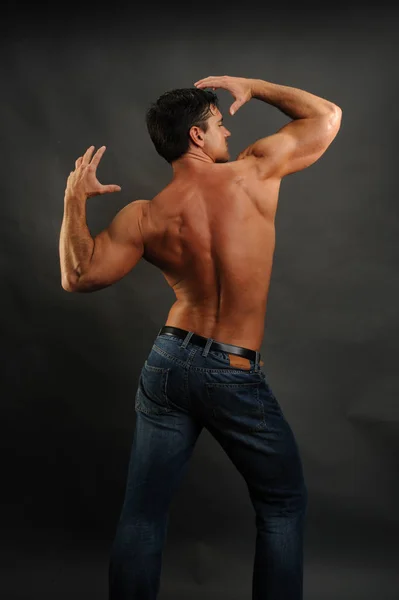 The handsome man stretches — Stock Photo, Image