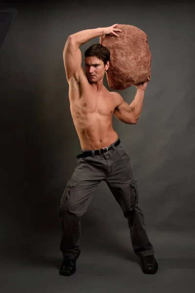 The hot guy is in a statuesque pose — Stock Photo, Image