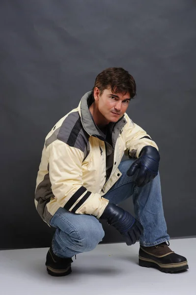 The handsome skier wears a jacket. — Stock Photo, Image