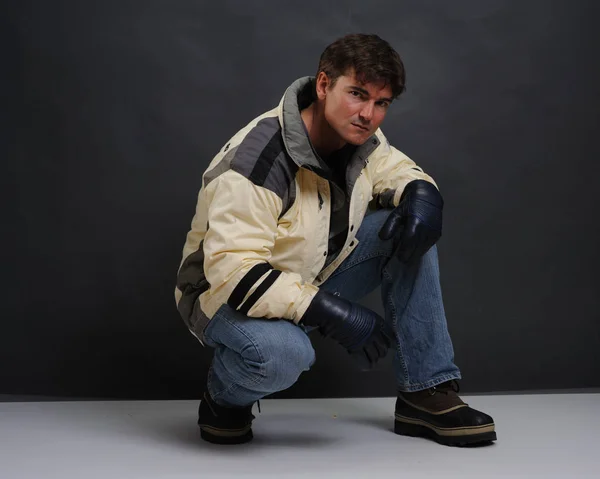 The handsome skier wears a jacket. — Stock Photo, Image