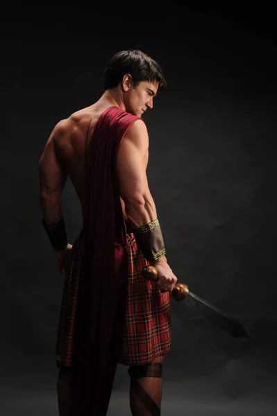 The loving highlander shows his muscles — Stock Photo, Image