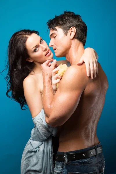 The attractive couple is in an embrace — Stock Photo, Image