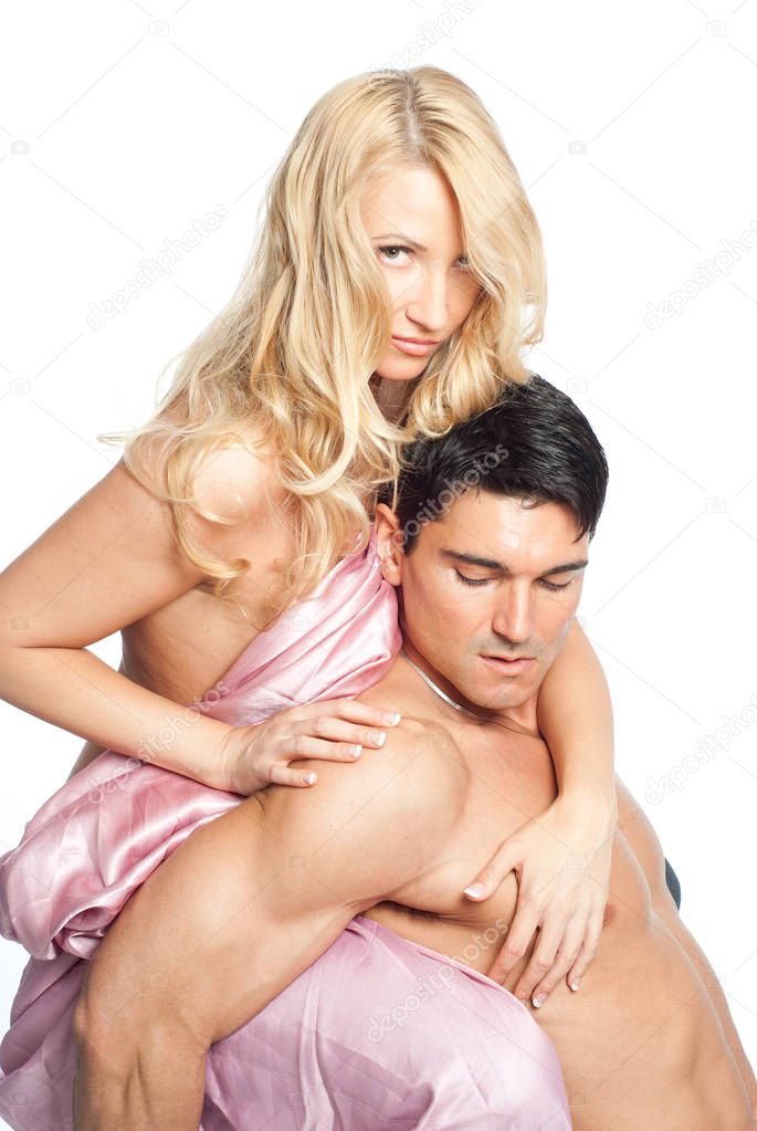 The sexy couple poses for an embrace together