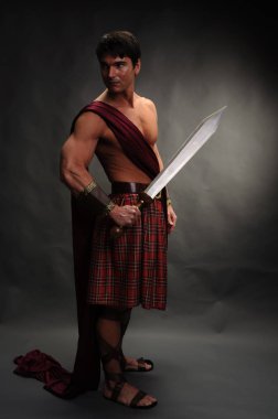 the handsome highlander holds a shiny sword clipart