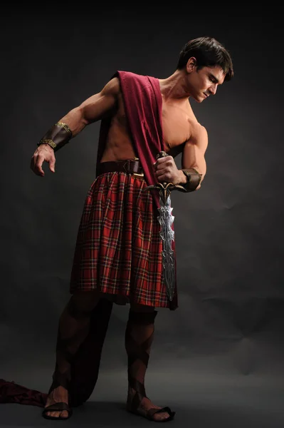 Handsome Highlander Holds Shiny Sword — Stock Photo, Image