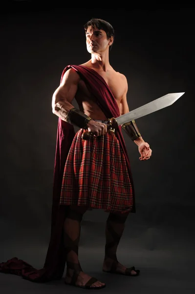 Handsome Highlander Holds Shiny Sword — Stock Photo, Image