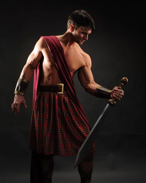 Handsome Highlander Holds Shiny Sword — Stock Photo, Image