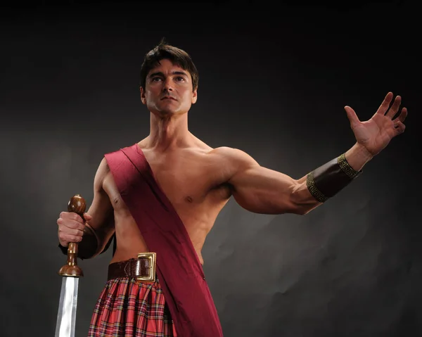 Handsome Highlander Holds Shiny Sword — Stock Photo, Image