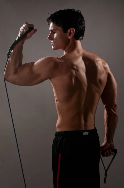 Homem Sexy Está Flexionando Seus Músculos — Fotografia de Stock