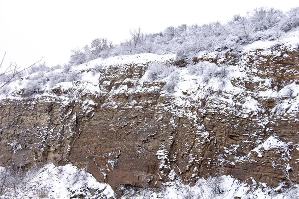 Red Sulin. Rocks in the snow during the day