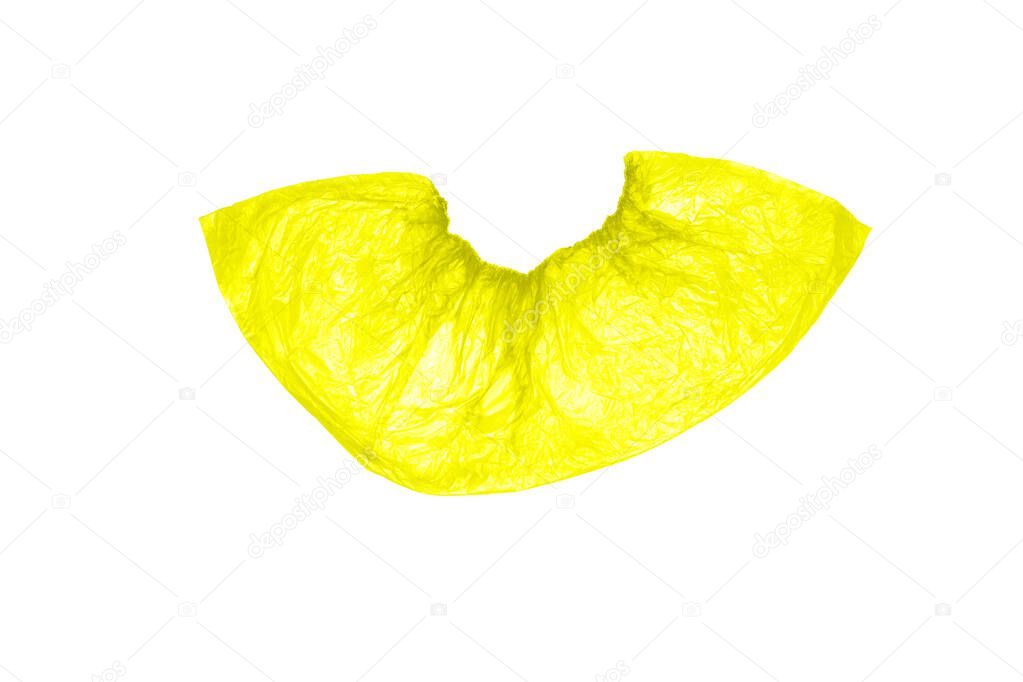 Insulated, disposable, medical Shoe covers in yellow on a white background. The view from the top.