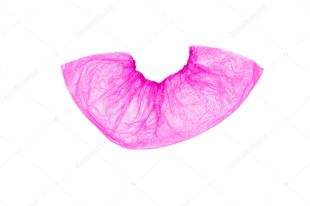 Isolated, disposable, medical Shoe covers in pink on a white background. The view from the top.
