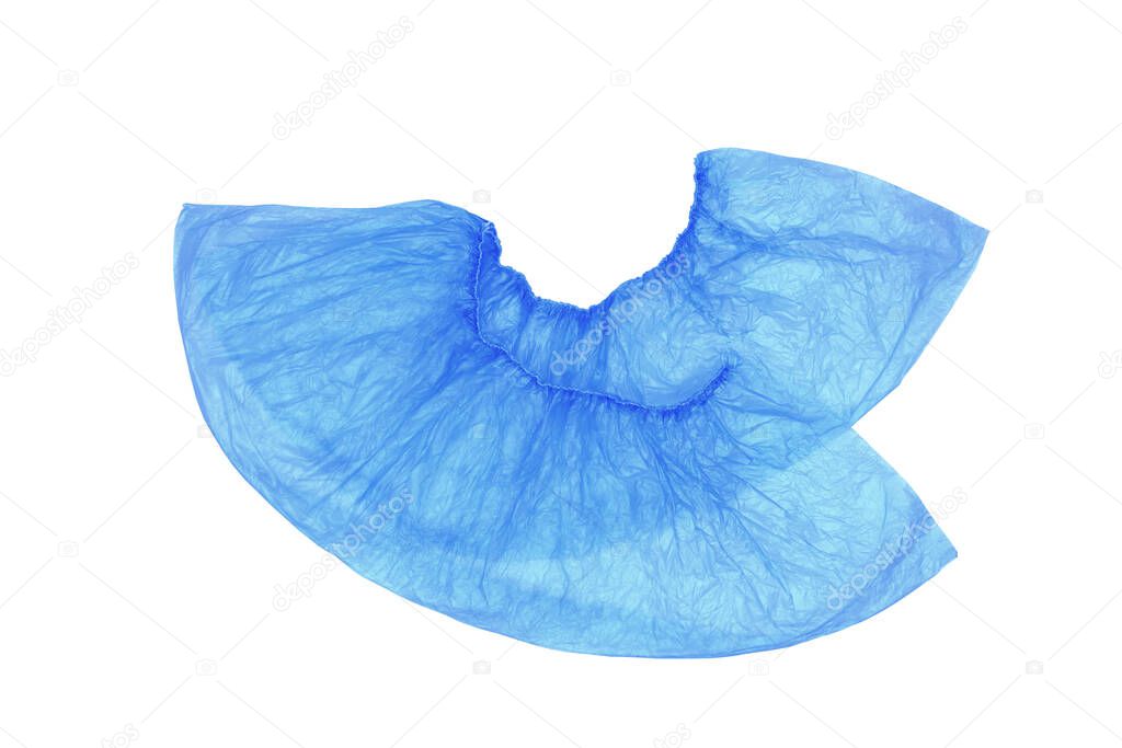 An isolated pair, two medical, blue, disposable Shoe covers on a white background. Shoe covers are superimposed on each other with heels.