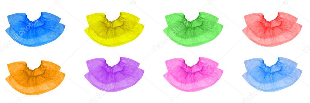 Isolated multi-colored pair of Shoe covers, superimposed on each other, red, pink, purple, green, yellow, orange, blue, blue on a white background.