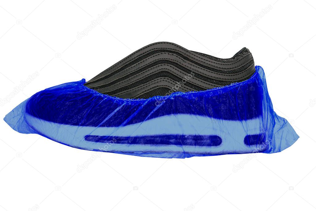 On an isolated, on a white background, sports Shoe is put on a medical, disposable blue Shoe cover. The concept of Shoe covers for shoes.