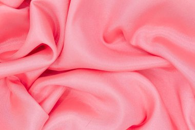 Zarif, modern pembe bir ipek ya da saten kumaşın yakın çekimi. Düğün, romantik bir geçmiş ya da Sevgililer Günü için kullanılabilir..