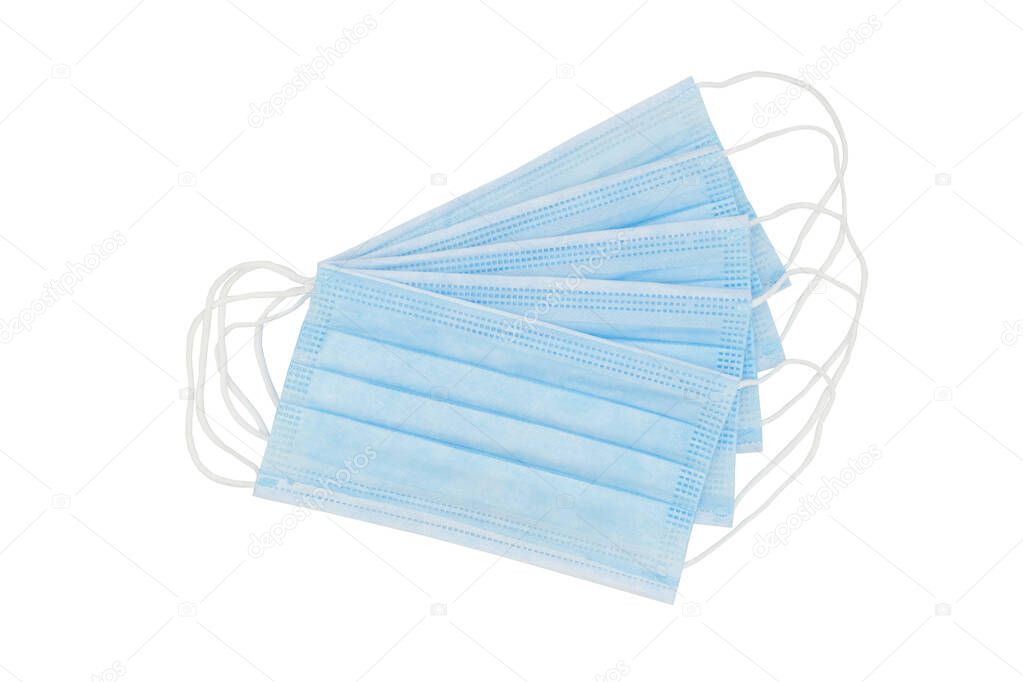 Isolated medical, surgical masks lie on top of each other to protect against flu, antiviral infections, and corona virus. Concept of safety, clean air and breathing.