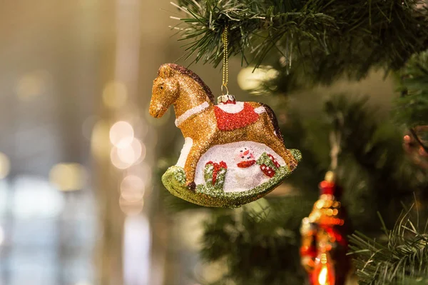 Christmas toy horse on a blurred background. Christmas and New Year holiday background — ストック写真