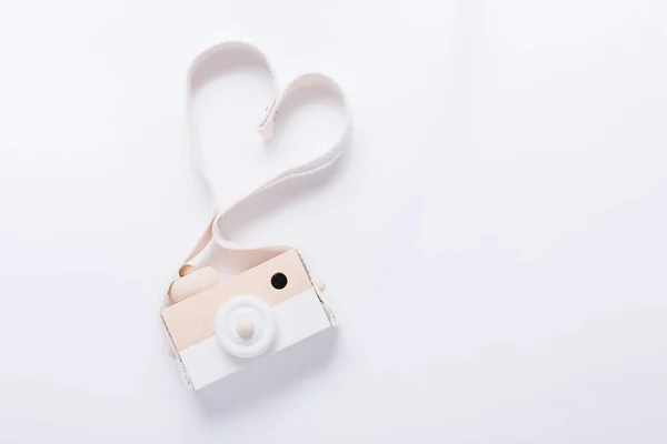Wooden nordiccamera toy for babies on white background, top view — Stock Photo, Image