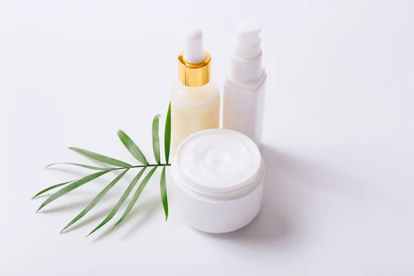 Herbal dermatology cosmetic products and cream on white background — Stock Photo, Image