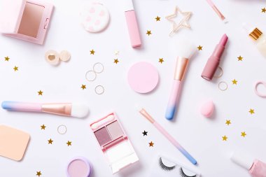 Set of professional decorative cosmetics, makeup tools and accessory on white background. Beauty, fashion and shopping concept. Flat lay composition, top view