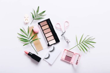 Set of professional decorative cosmetics, makeup tools and accessory on white background. Beauty, fashion and shopping concept. Flat lay composition, top view