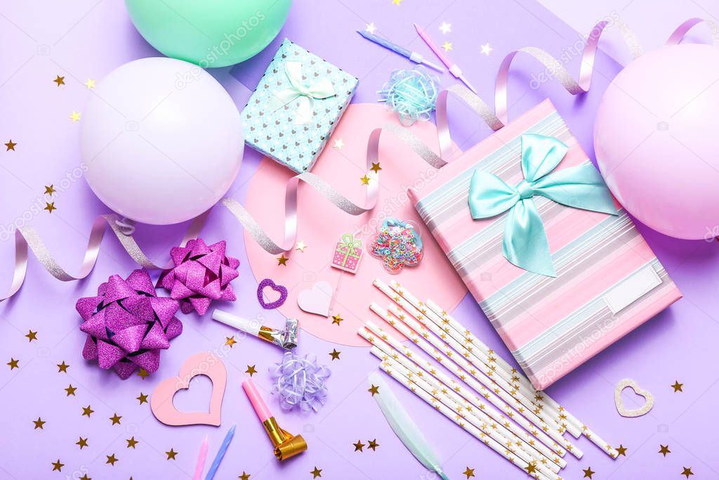 Colorful celebration background with various party confetti, balloons, gifts, and decoration on lilac background.
