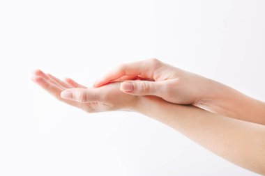 Beautiful womans hands on the white wall background