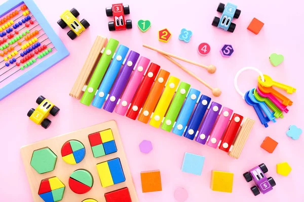 Colorful kids toys on pink background. Top view — Stock Photo, Image