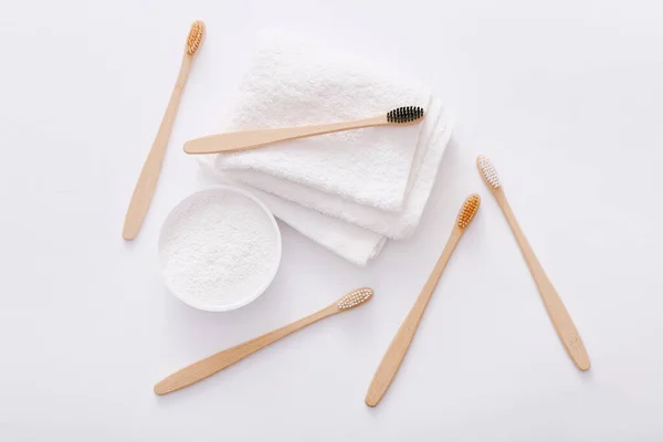 Wooden teeth brushes and tooth-powder on white backgroud, top view. Zero waste concept — Stock Photo, Image
