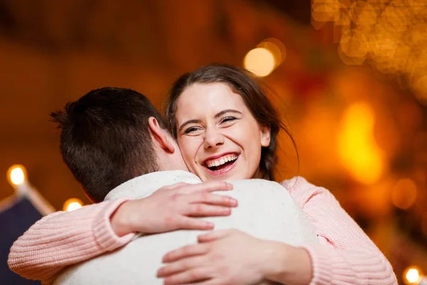 Beautiful pair embraces at hall — Stock Photo, Image