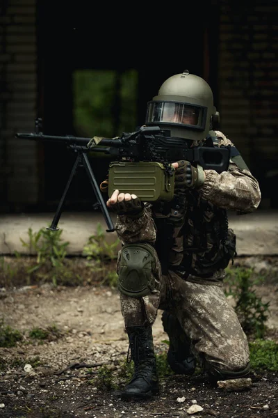 Striped player with submachine gun