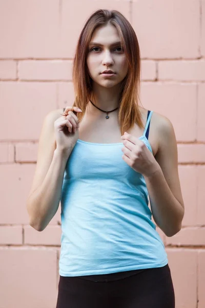 Image of sports girl at pink brick wall — Stock Photo, Image