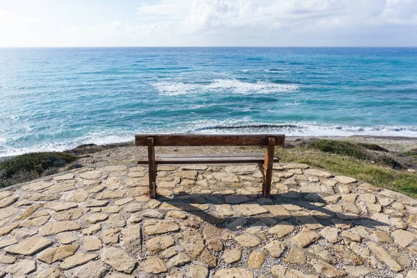 Picture of bench on background of sea — Stock Photo, Image