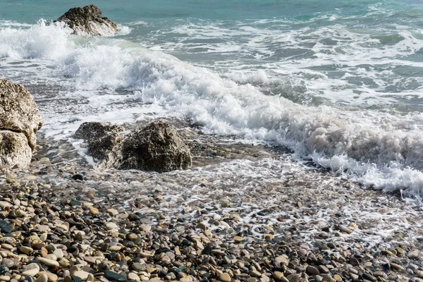 Picture of foamy sea, pebble beach, stones