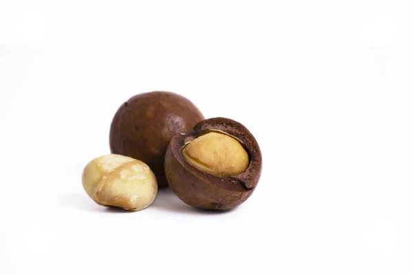 Shelled macadam nut closeup on a white background. — Stok Foto