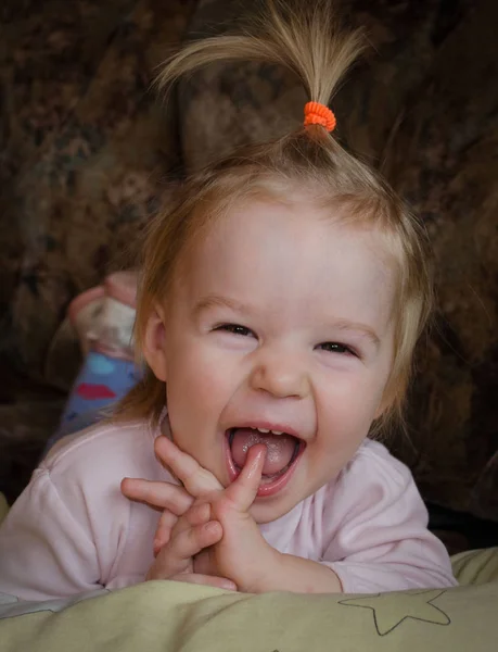 Little joyful girl with tongue hanging out — Stock Photo, Image