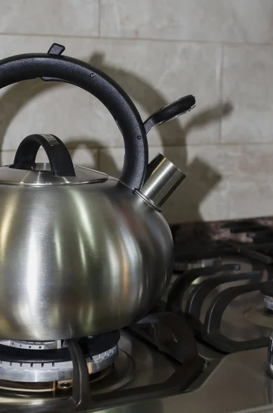steel kettle on a gas stove, home cooking, boil water for tea