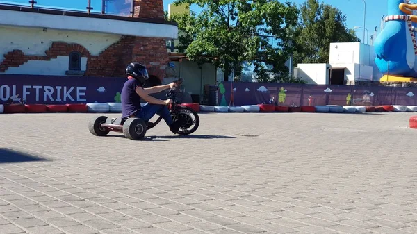 10.07.2019 -Riga, Latvia Young man riding electro motorcycle — ストック写真