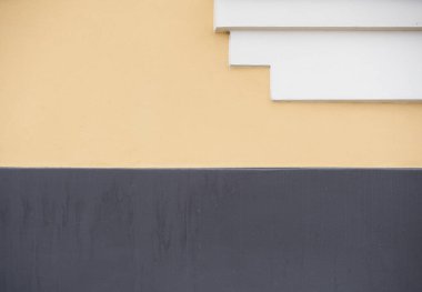 Background of old yellow painted wall and white stairs