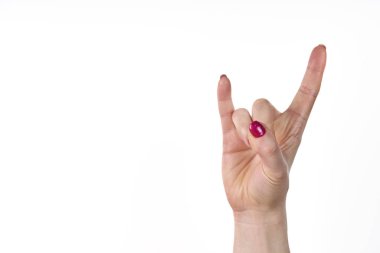 Young woman hand in I love you sign