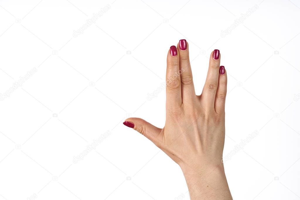 A man hand doing the Vulcan salute on a white background. Vulcan hand salute against. Spock hand. Alpha