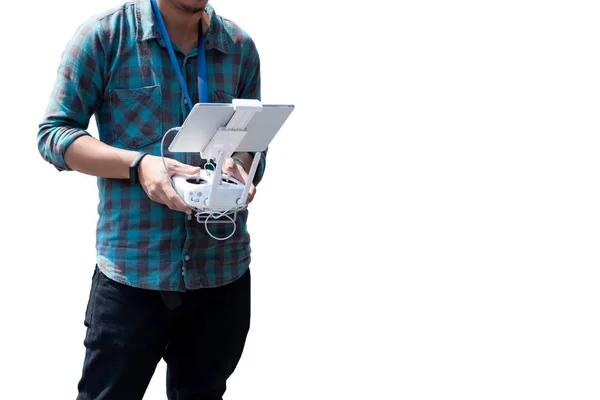 young man with controls a drone in white background.
