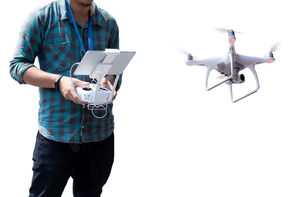 young man with controls a drone in white background.