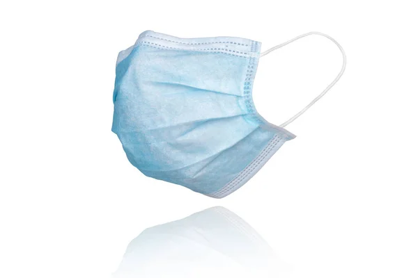 Gribe ve Corona virüsüne karşı korunmak için beyaz arka planda bulunan tıbbi maske ya da Covid-19 tüm dünyaya yayılıyor.