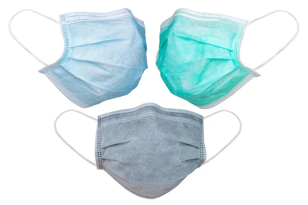 Gribe ve Corona virüsüne karşı korunmak için beyaz arka planda bulunan tıbbi maske ya da Covid-19 tüm dünyaya yayılıyor.