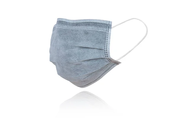 Gribe ve Corona virüsüne karşı korunmak için beyaz arka planda bulunan tıbbi maske ya da Covid-19 tüm dünyaya yayılıyor.