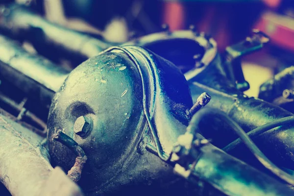 Old Machine parts in warehouses. Car parts in old warehouses. Used vehicle part for recycling in the scrap yard garage. Recycle goods/meta.