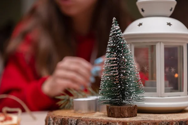 Decorative Christmas tree toy standing on a wooden stand. girl s — Stock Photo, Image